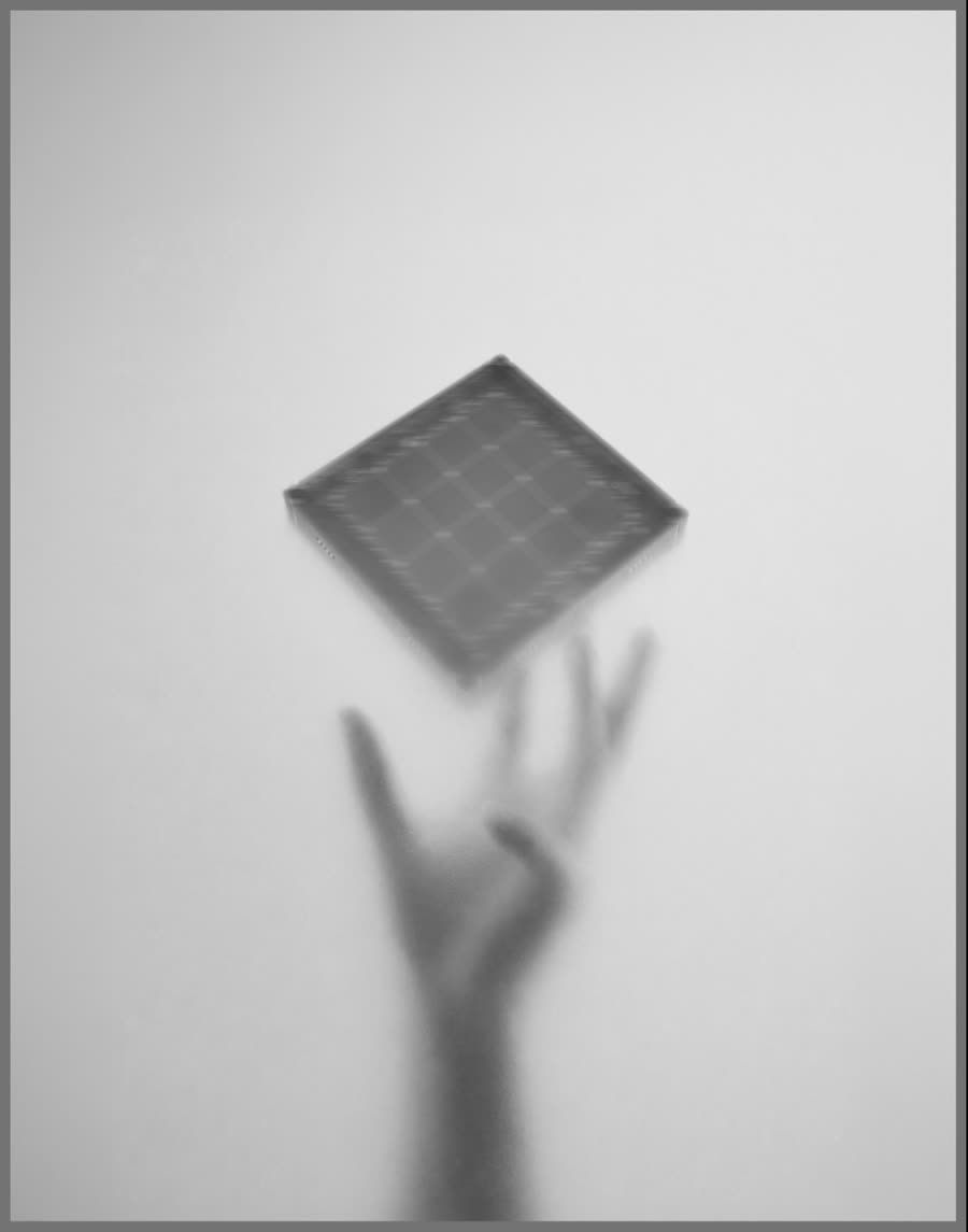 A hand releasing the ZONA module into the air.